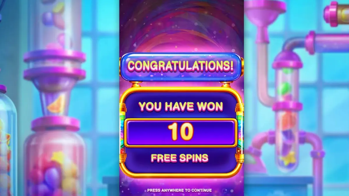 Interface do jogo de slot Sweet Burst com elementos de laboratório e doces coloridos